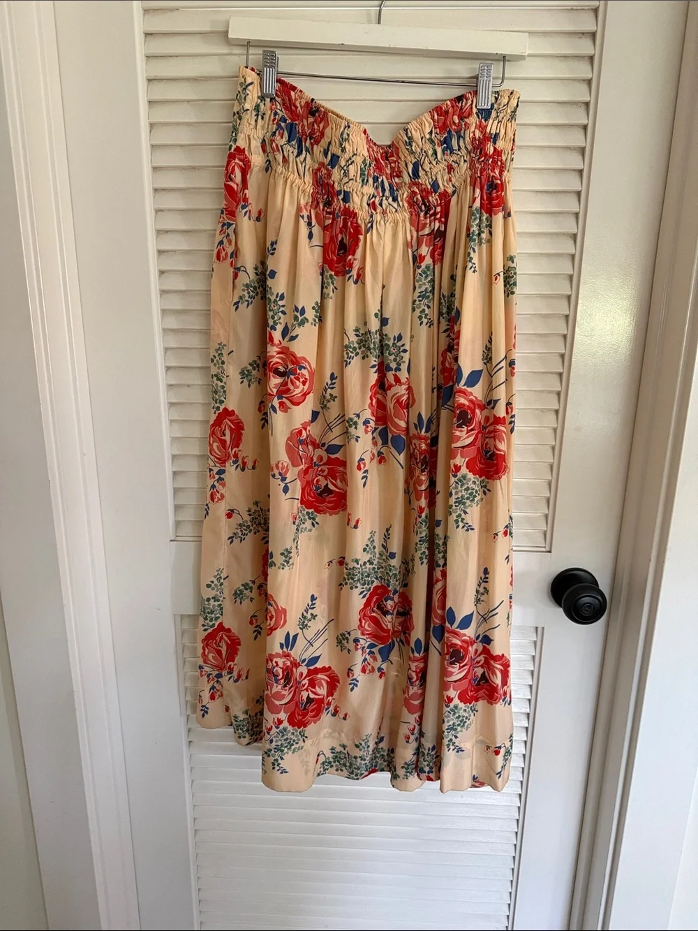 THE GREAT. Smocked waist cream skirt with Red Floral Print